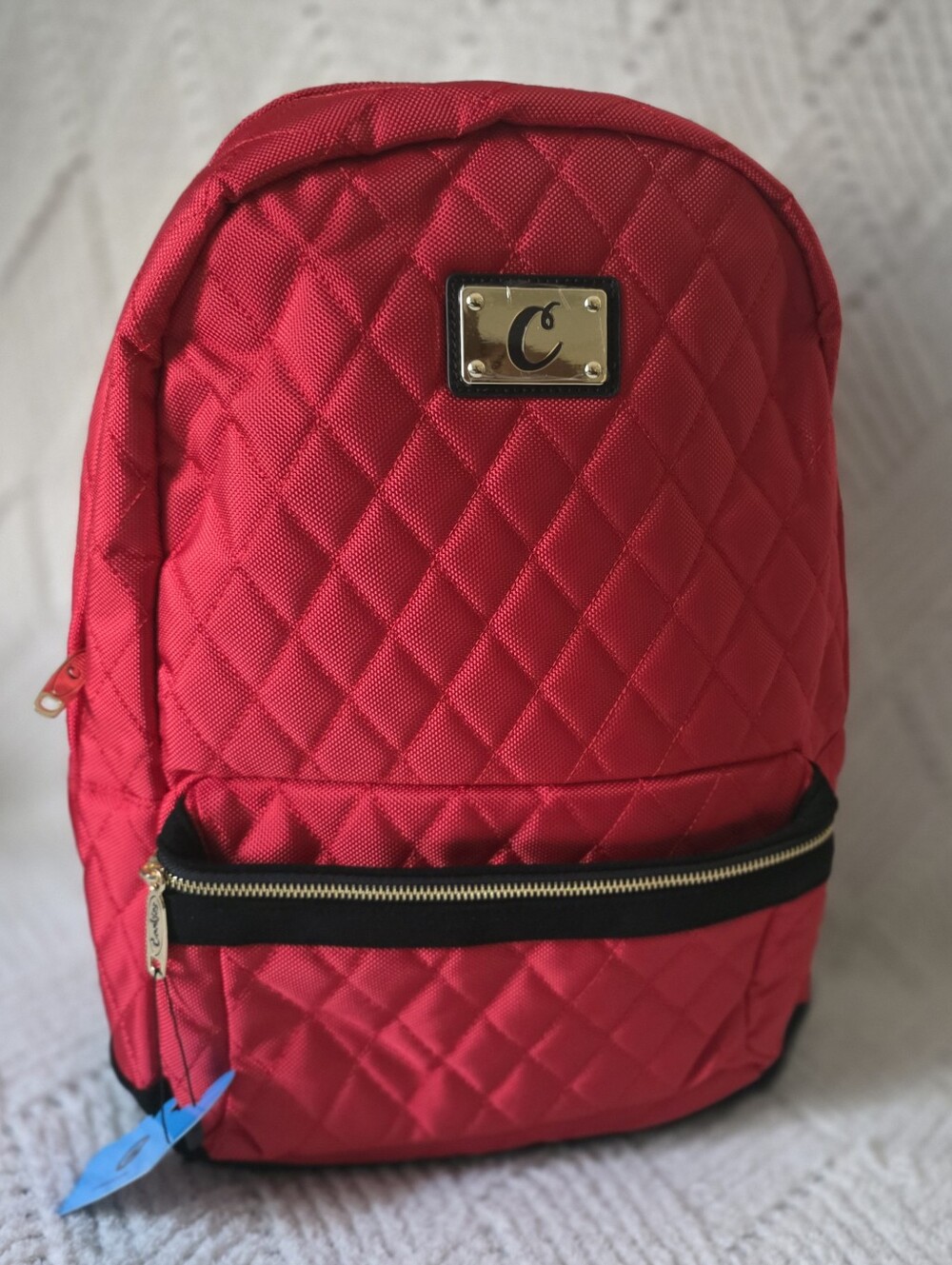 Quilted Red Backpack with Gold Plate and Black Trim